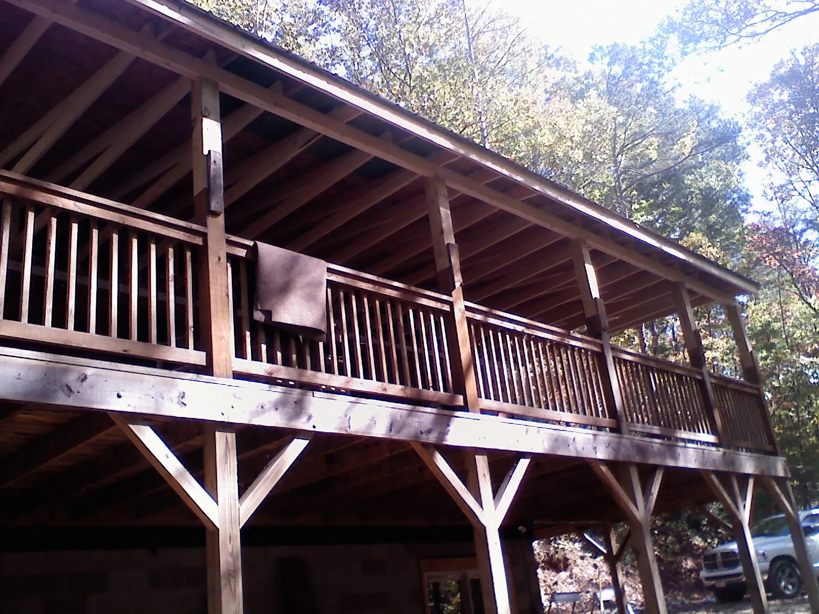 Timber framing under a new elevated porch and deck — Roof Leak Repair in Stonington by Roofing Brothers